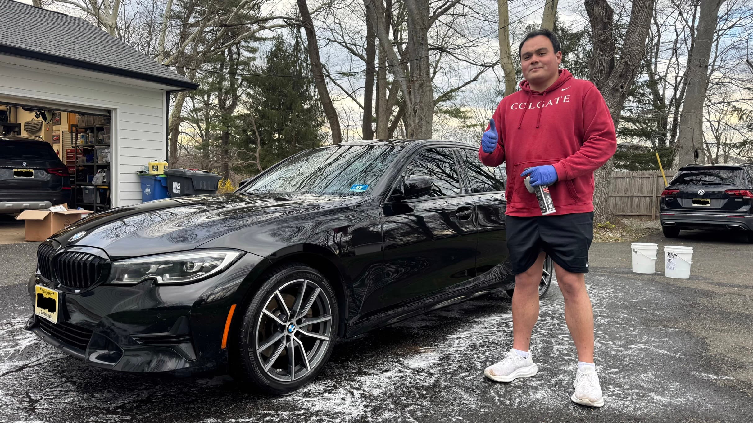 Ryan detailing a car in a residential driveway